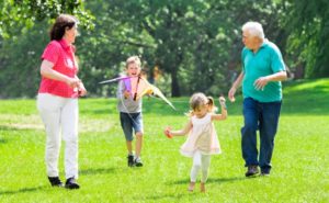 Couple-In-Compression-Socks-Playing-With-Grandkids