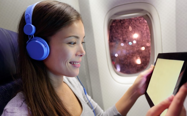 Woman-Watching-Tablet-While-Flying
