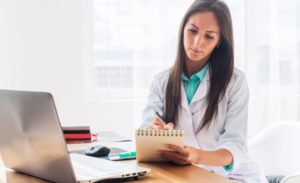 Doctor-Writing-A-Prescription-For-Compression-Stockings