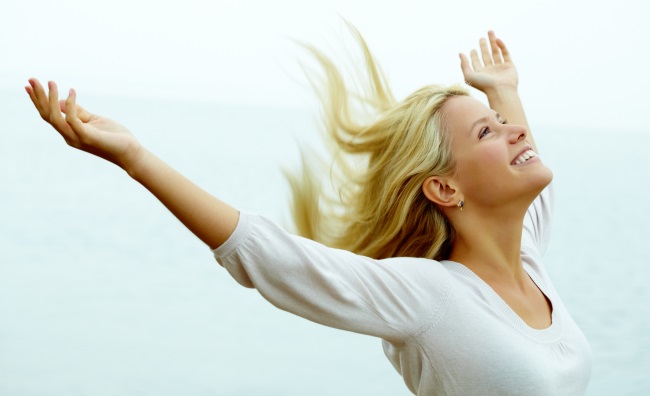 Woman-Outside-With-Arms-Up