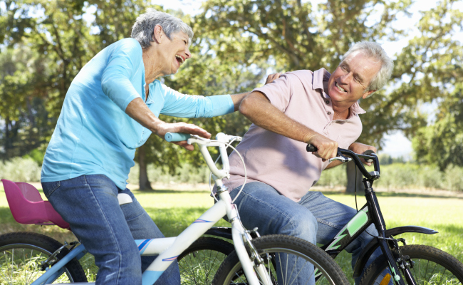 Older-Couple-Riding-Bikes-Outside