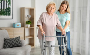 Woman-Getting-Help-With-Her-Disability-Equipment