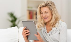 Woman-Checking-Tablet-For-Lymphedema-Products