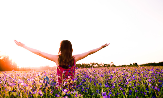 Woman-In-Filed-With-Arms-Out