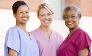 3-Smiling-Nurses-Wearing-Scrubs
