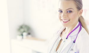 Smiling-Nurse-In-Lab-Coat