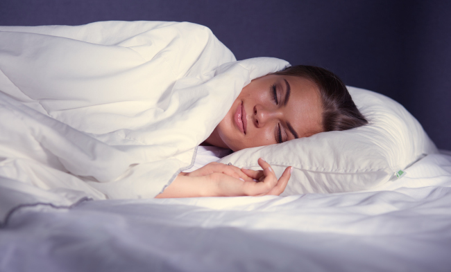 Woman Sleeping In Bed